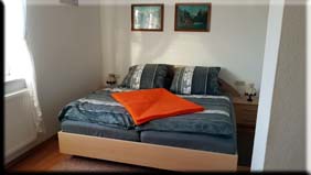 Schlafzimmer der Wohnung 1